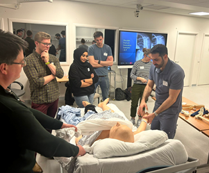 Person lifting arm of patient